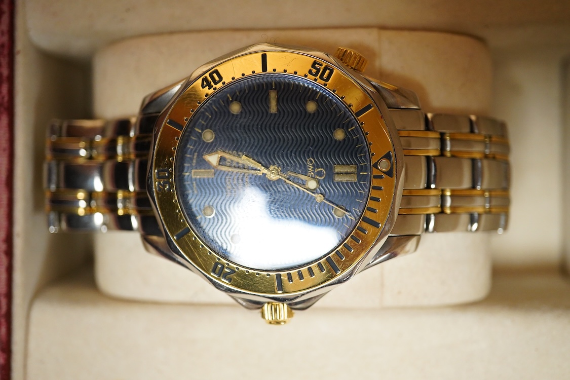 A gentleman's mid 1980's stainless steel and gold plated Omega Seamaster Professional Chronometer automatic wrist watch, with blue dial, dot numerals and date aperture, movement c.1109, case diameter 40mm, on an Omega st
